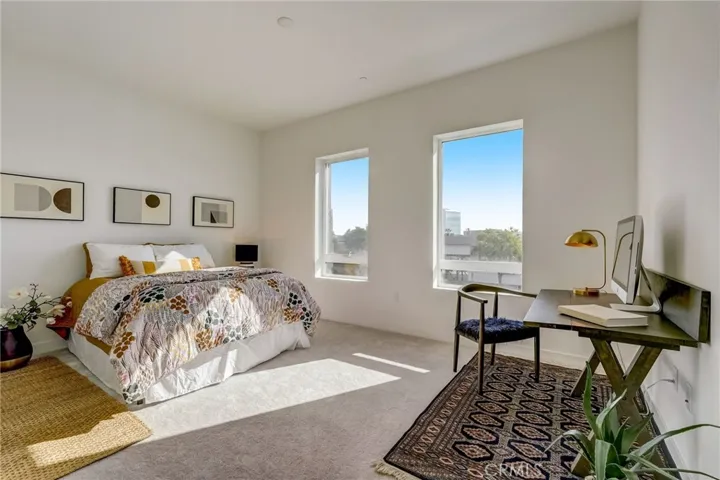 The 2nd bedroom is also spacious and light and bright and makes the perfect home office or guest space with an en suite bath.