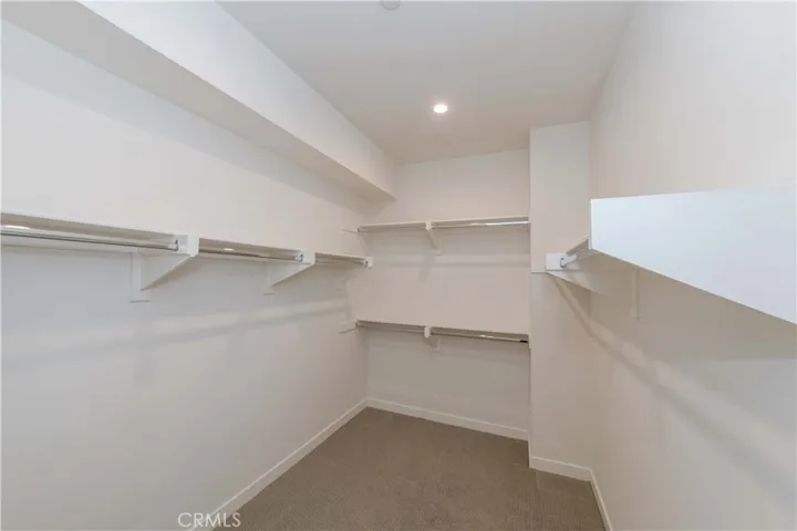 Huge walk in closet in primary bedroom.