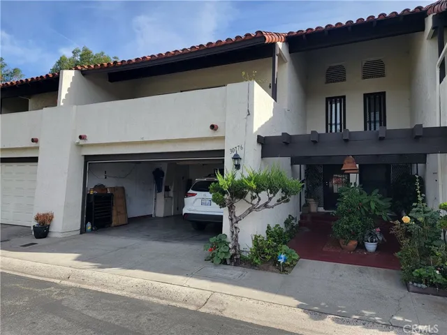 Front entry with attached garage.