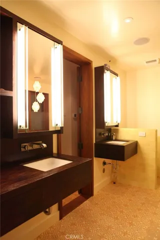 Master Suite dual vanities. This bath houses the commode, walkin partner shower, Soaking tub you won't believe and teak closets.