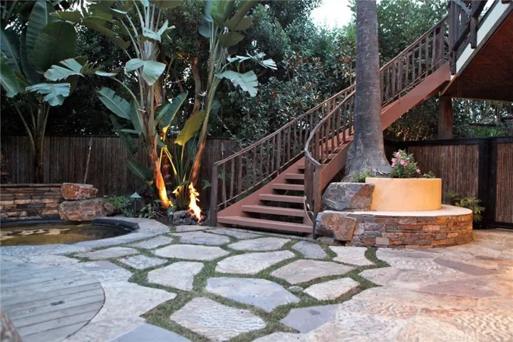 Secluded fun patio.  Black bottom Jacuzzi with waterfall.  Goes to game room and master suite.