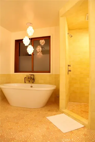 Here's the soaking tub!  Entry to quartz tile lined partner shower