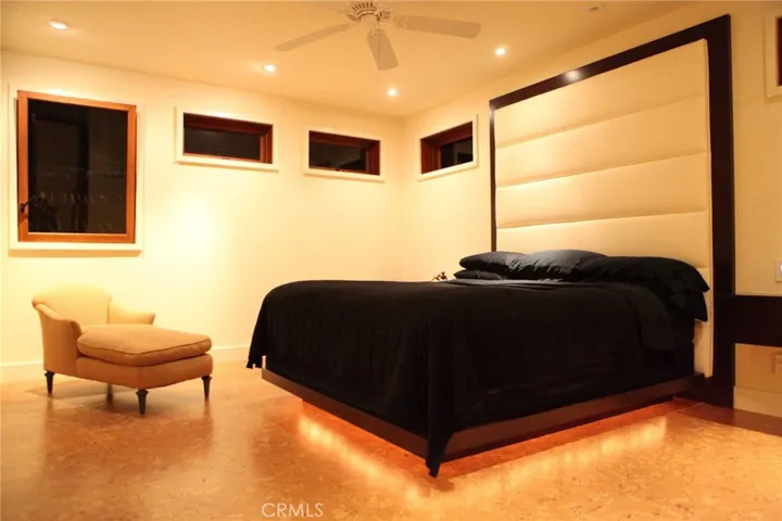 Nice big and lighted master bedroom on lower level.  Wood floors.
