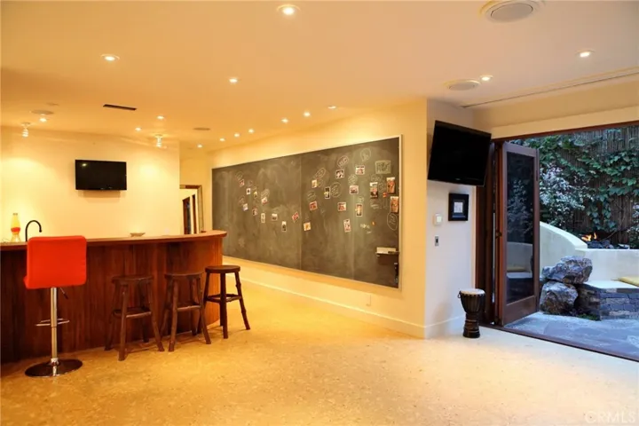 More game room views/8' chalkboard (learning at home these days?) Powder room and laundry room on this level