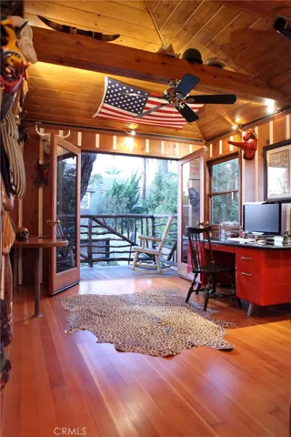 Being used as an office. Outside deck and private entrance.  Maple floors and pine paneling all from the original structure.