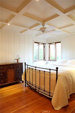 One of three bedrooms on main level.  Maple floors nice windows to garden trees. overhead fan, maple floors, builtin closet.