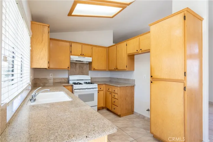 Kitchen with Granite Countertops and Pantry