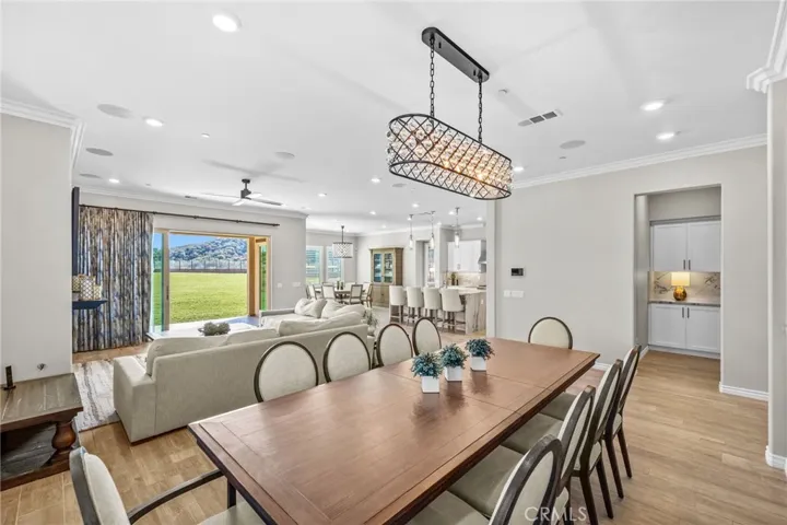 Warm and inviting living space freshly painted with neutral colors. Crown molding and surround sound throughout.