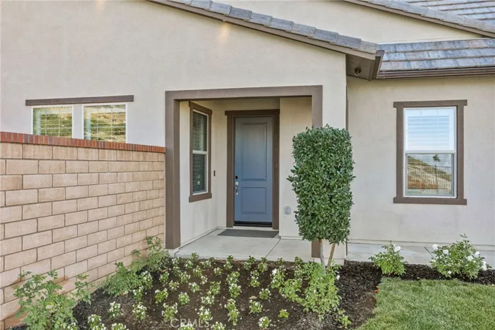 Freshly landscaped inviting entrance.