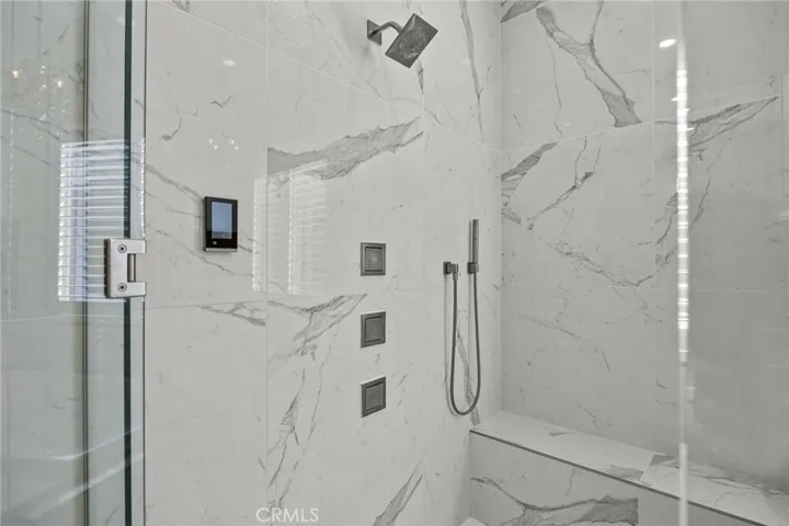Digital personal settings on your quartzite steam shower with multiple shower heads.