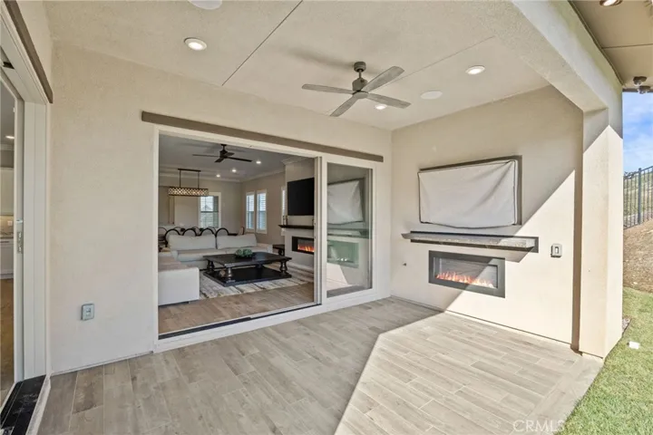Indoor/outdoor living in this CA Room addition with one-of-a-kind upgraded mantle, cozy gas fireplace, and wired for TV.