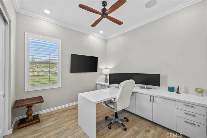 Bedroom #4 currently an office with quartz desk and locking cabinetry.  May easily be converted back to a 4th bedroom without damaging floors or baseboards. Gorgeous sweeping panoramic view of the mountains!