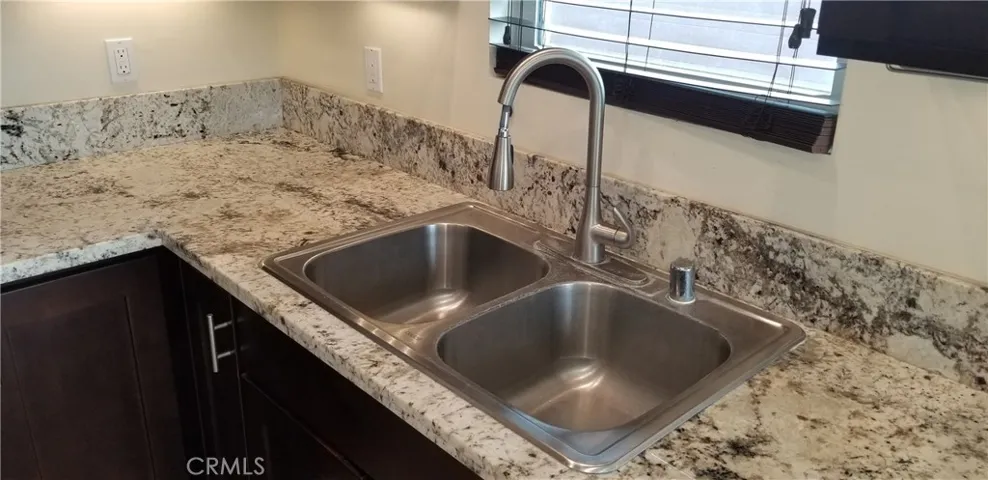 granite counters with sink in kitchen