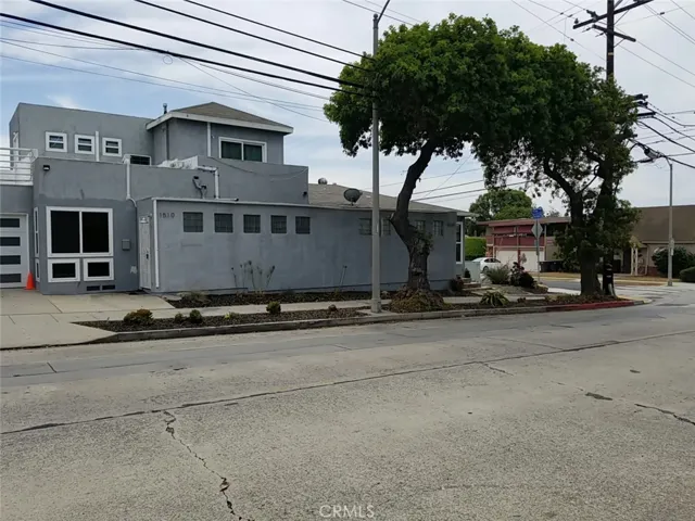 Unit is on right corner with its garage showing on the left. Unit in the middle is two-story unit with its own garage too.