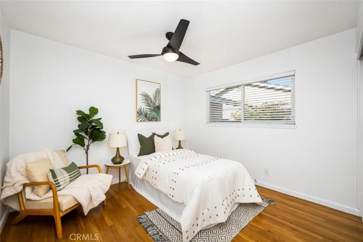 2nd bedroom; ceiling fan and hardwood flooring