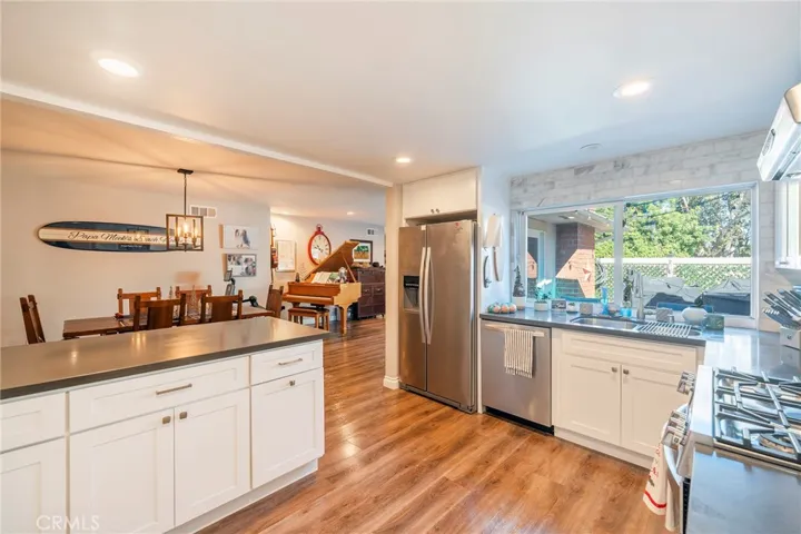 Kitchen showing dining and living room
