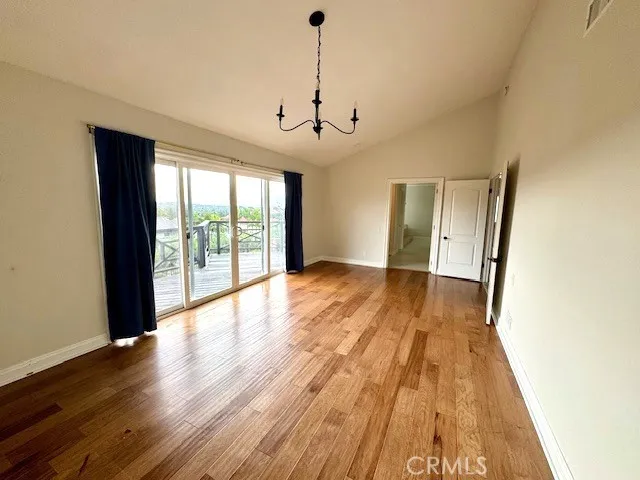 Large main bedroom with balcony and view