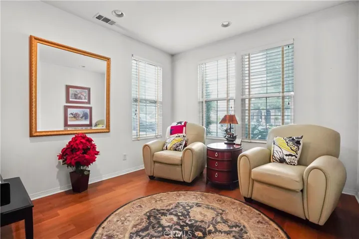 Downstairs: Bonus room at entrance- used as a formal living area or can be used as an office/bedroom