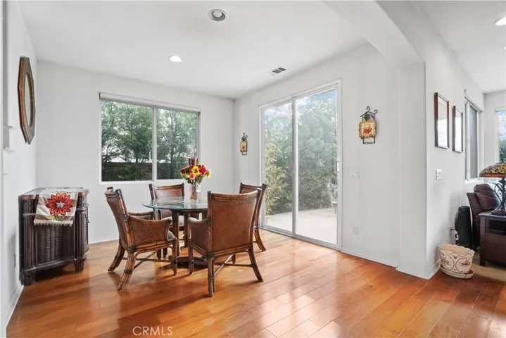 Nook adjacent to kitchen and family room. Glass sliding door leads to spacious backyard