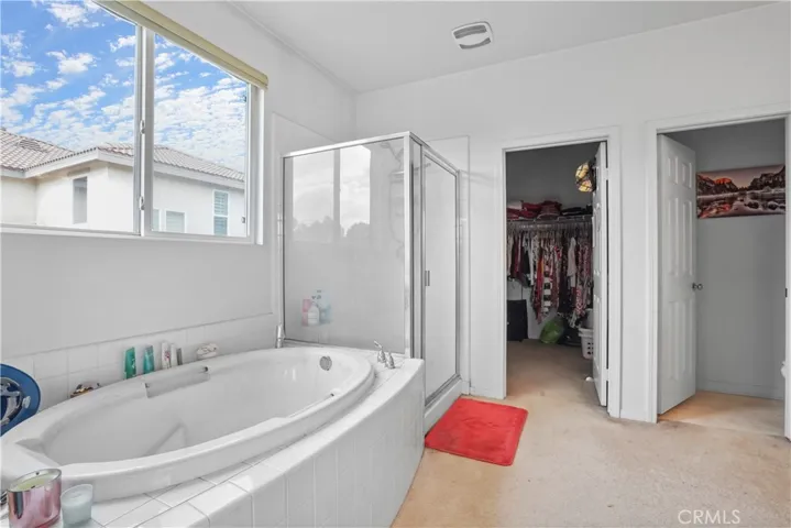Upstairs: Main Suite private bathroom with walk-in shower and soak-in tub