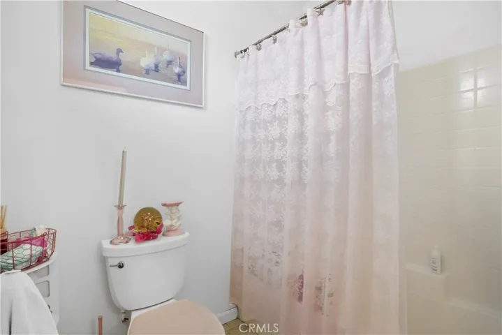  
Upstairs: Bathroom 2 with tub in shower
