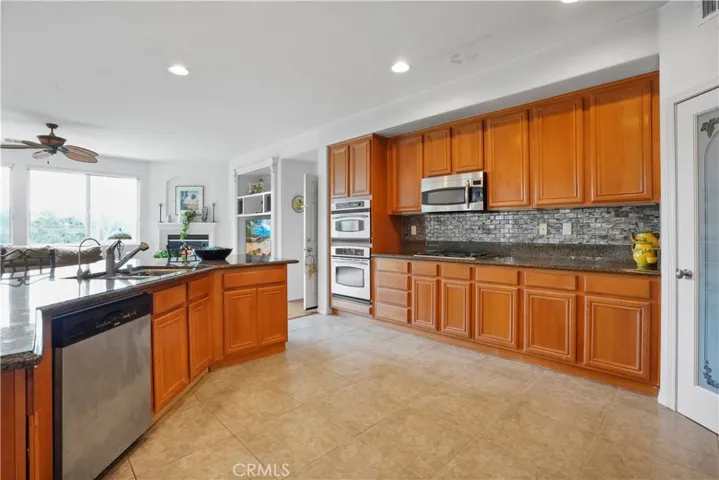 Kitchen appliances included: stove top range, dishwasher, double oven, and microwave