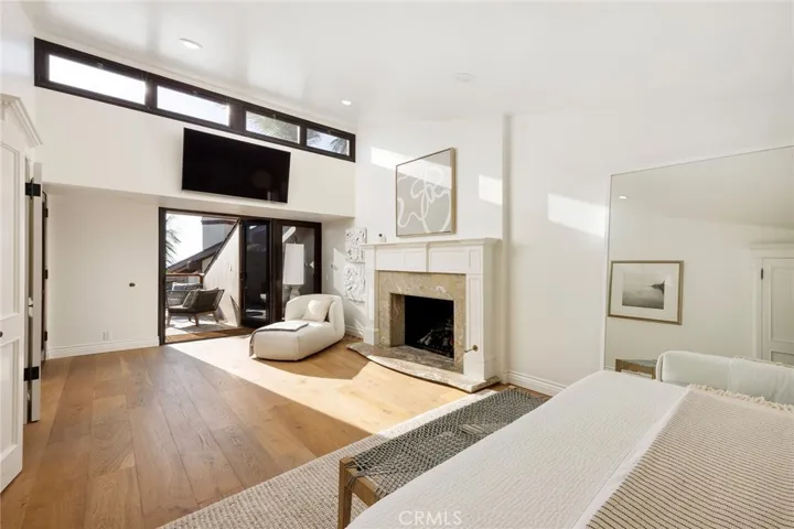 Main Floor Primary Suite with fireplace and deck