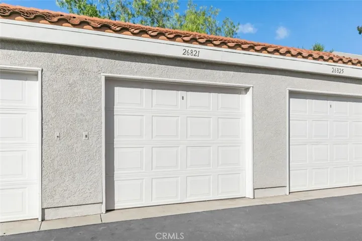 DETACHED SPACIOUS ONE CAR GARAGE, ALSO HAS A COVERED CARPORT SPACE.