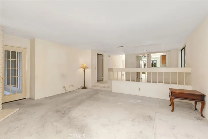 VIEW FROM LIVING ROOM LOKING TOWARD KITCHEN AND DINING ROOM.