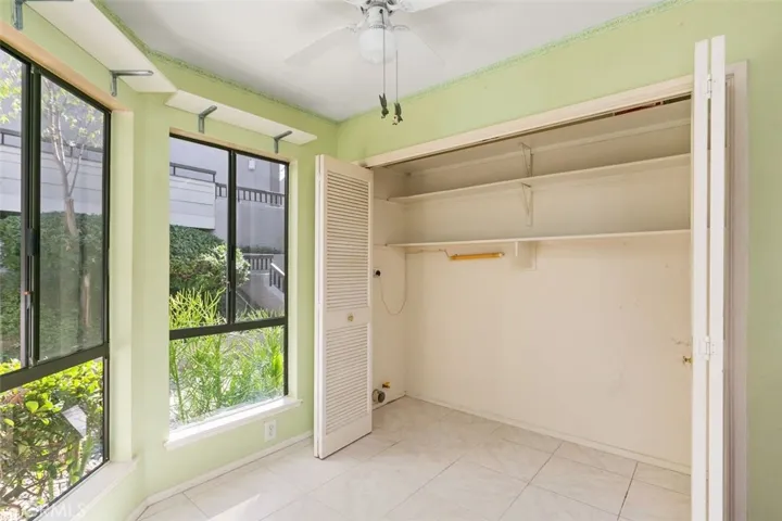LAUNDRY CLOSET WITH ADDITONAL STORAGE AREA.
