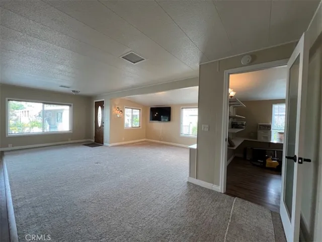 New carpet and view of large pantry