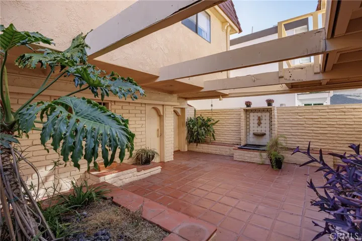 Patio area between both units, this view shows the fountain.