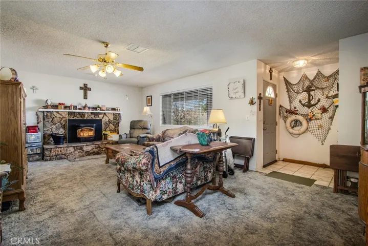 LIVING ROOM WITH COXY FIREPLACE