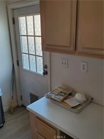 Desk and Back Door in Laundry Room