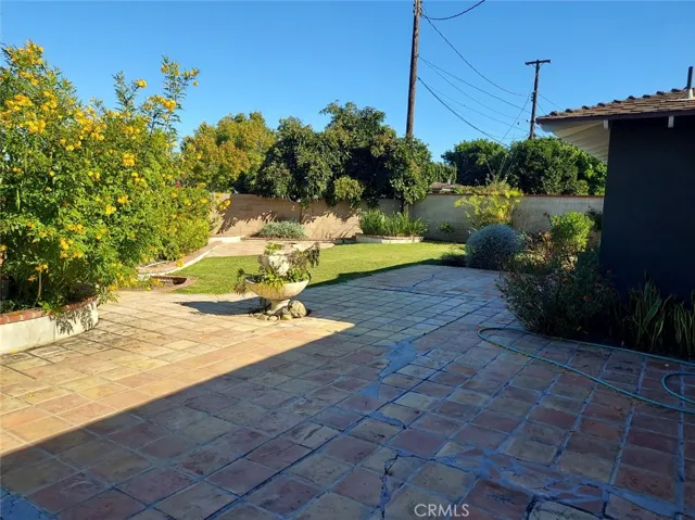 Walled in back yard with lawn