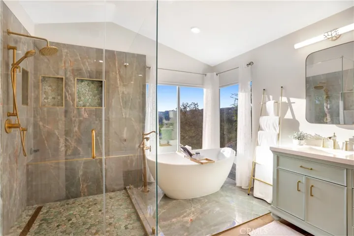 Completely Remodeled Master Bathroom with Elegant Soaker Tub and Spacious Walk-in Shower.
