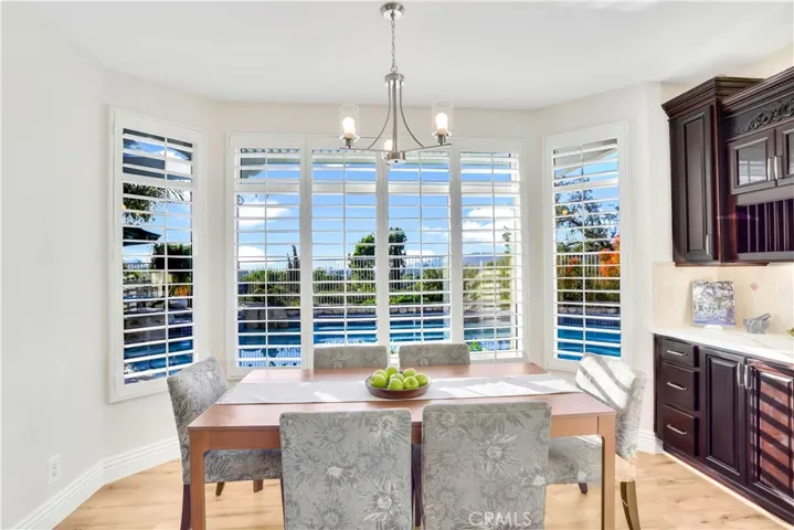 Spacious Breakfast Nook Overlooking the Pool and View.