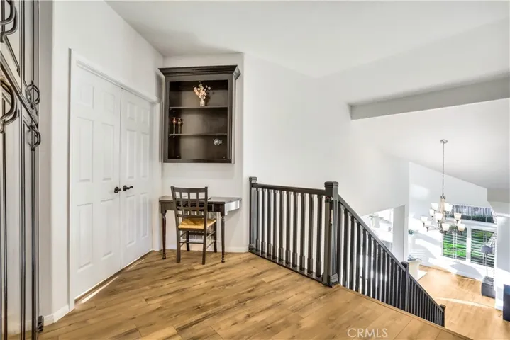 Wide Landing upstairs with Lots of Built-in Cabinets for Plenty of Storage.