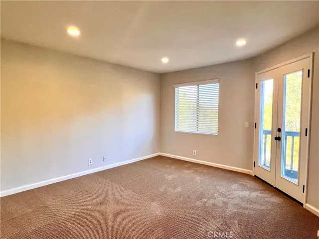 Primary bedroom with access to the balcony