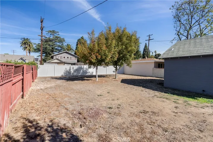 Expansive back yard large enough for a pool, or extend the garage, add a guest house, or whatever your heart desires!