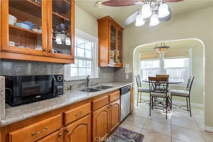 Remodeled kitchen with granite counters, and light and airy breakfast nook.