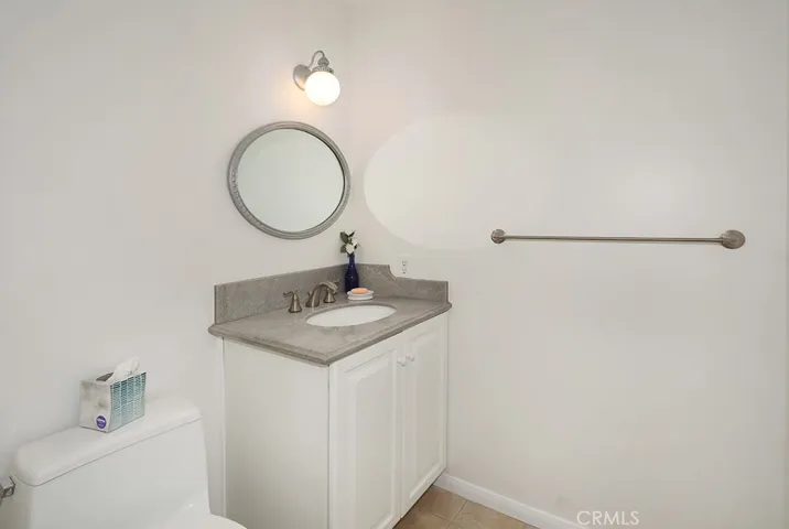 1/2 bathroom near the kitchen, game/bonus room and living room
