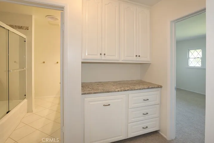 Linen cabinets and storage at the end of the hallway