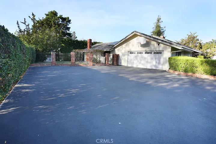 HUGE driveway, 2-car direct access garage with basketball hoop