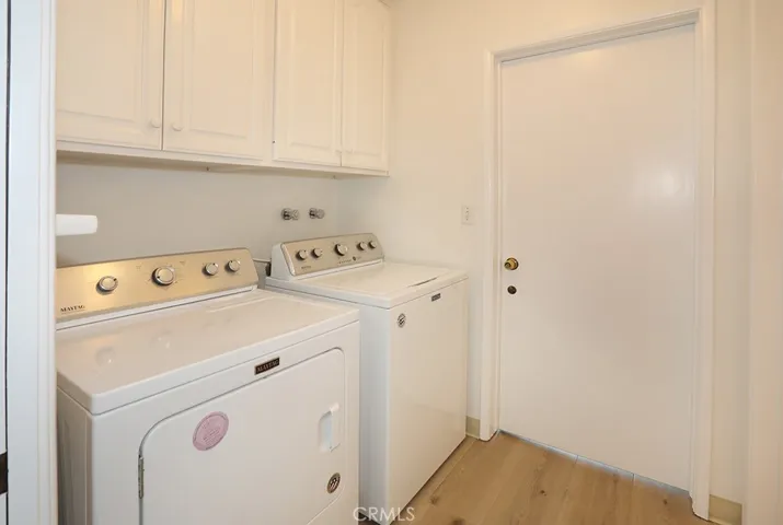 Inside laundry room (washer and dryer included) leads to the large 2-car garage