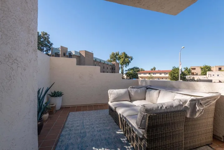 Elevated from the street & off of the living room you'll find an expansive sunny terrace