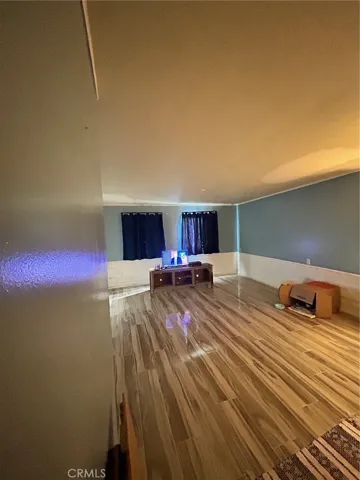 Den with beautiful flooring