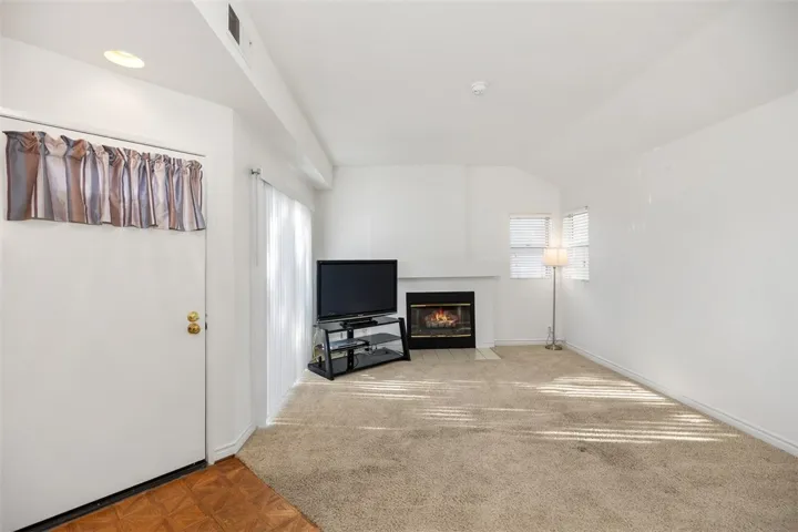 The Fireplace in the Living Room adds Warmth on those chilly nights.  Television and Stand Included with Sale of the Properry