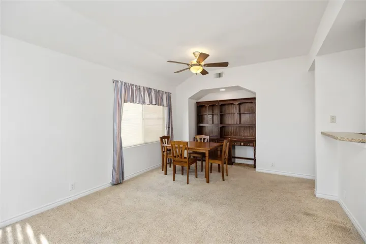Another View of the Spacious Dining Area with Ceiling Fan
