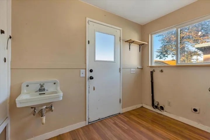 Laundry room area includes a sink